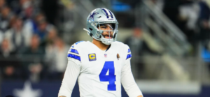 Dak Prescott hangs his head in disappointment after playoff loss